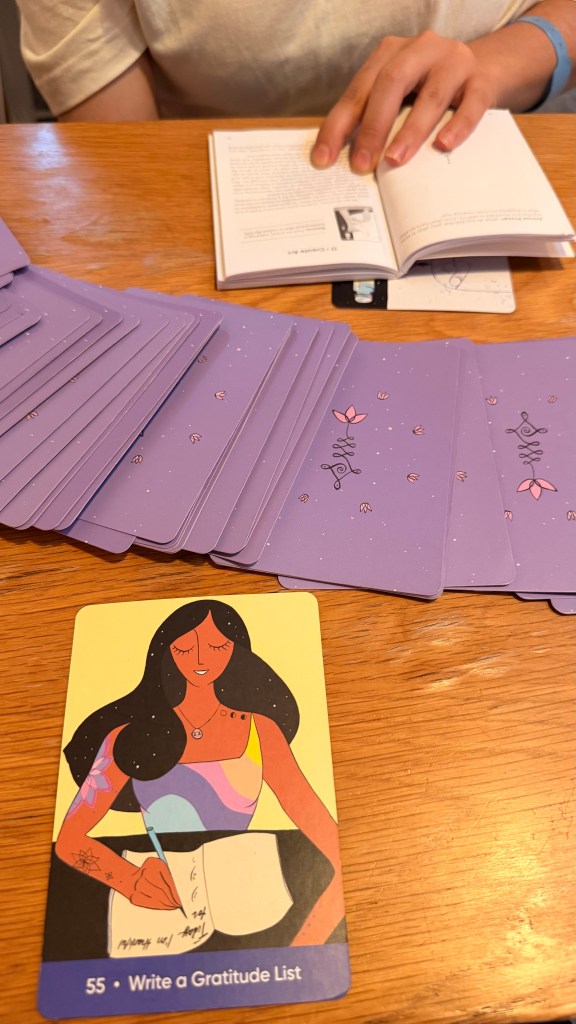 pulling cards from a deck at Maya Moon